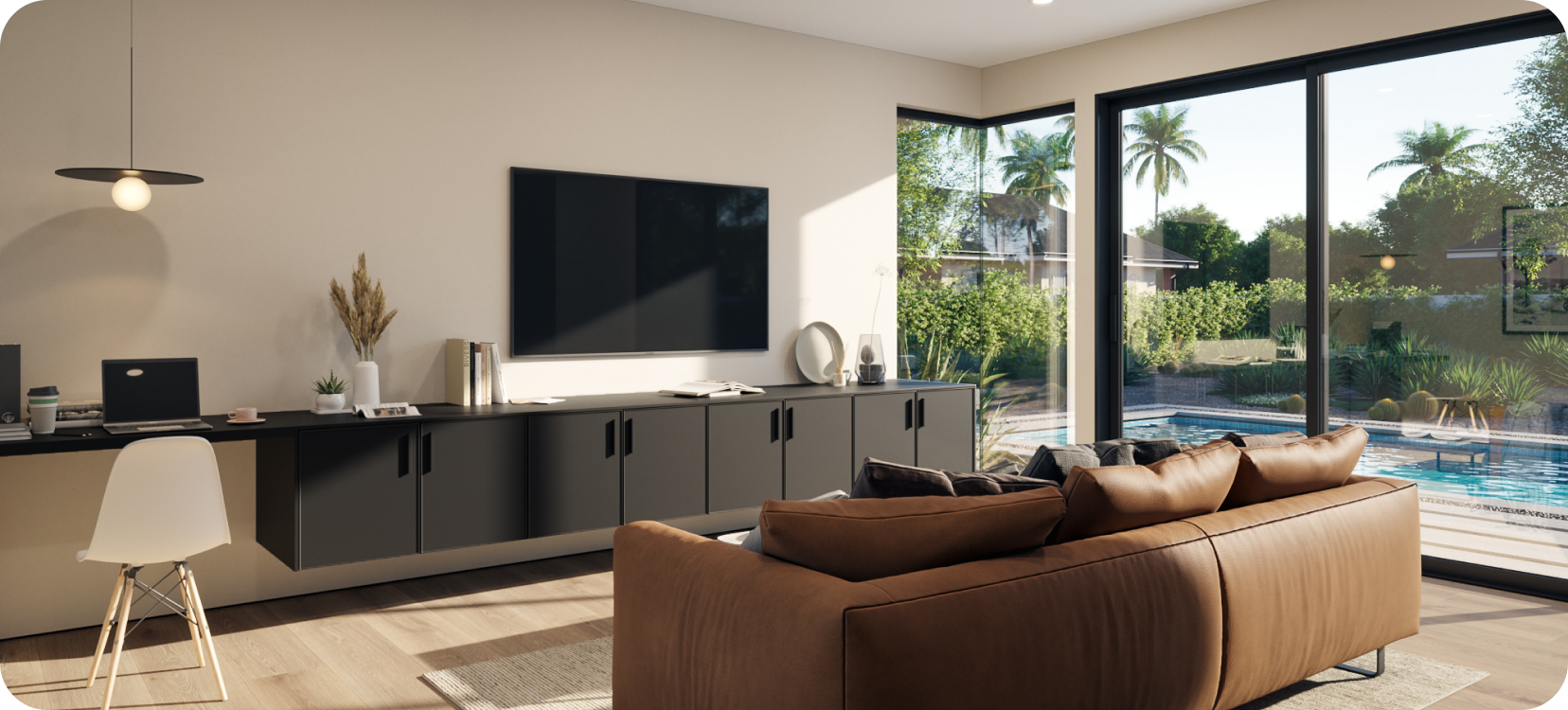 A living room with a couch facing a television on a low cabinet.